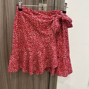 Red wrap skirt with white polka dots